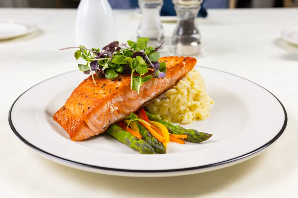A close up of salmon, rice, and vegetable dinner, one of many resident's favorite meals at Essex Meadows in CT.