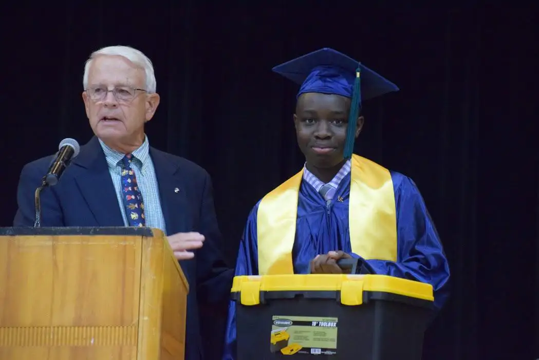 Michael Dowley speaking at Eighth Grade Graduation at Saint Martin de Porres Academy.