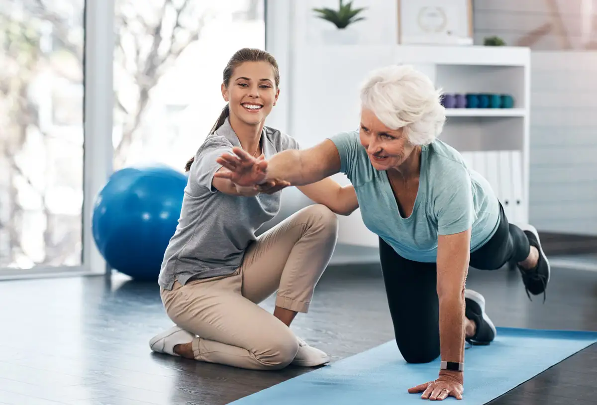 A senior woman in therapy while getting help from a licensed therapist. Explore occupational Therapy vs physical therapy at Essex Meadows.
