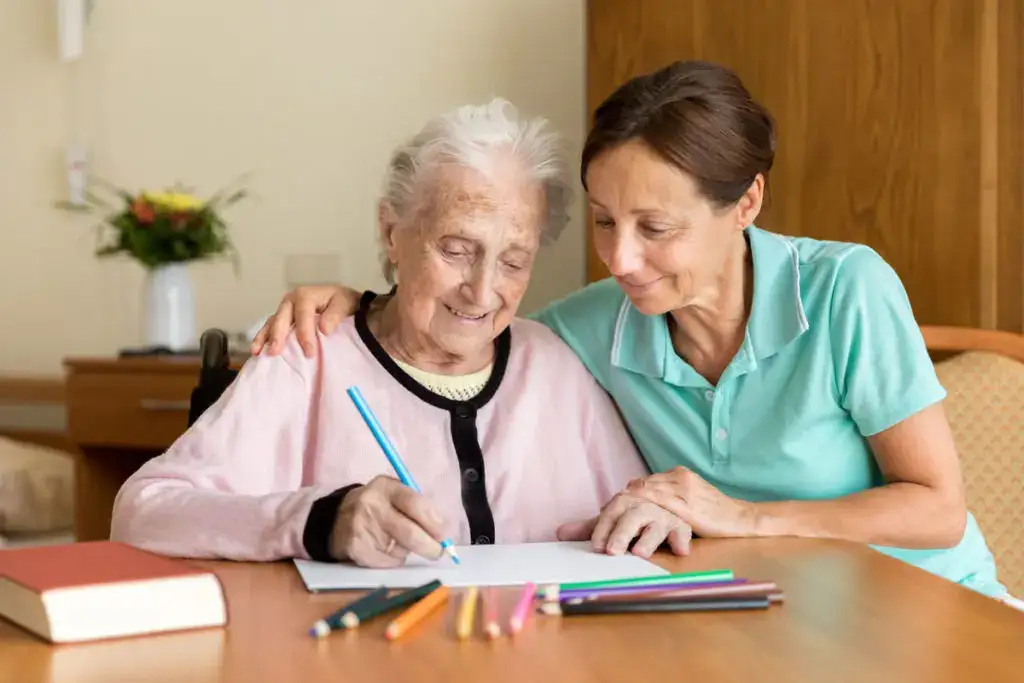 A senior woman getting assisted with occupational therapy by a licensed therapist. Explore occupational Therapy vs physical therapy at Essex Meadows.