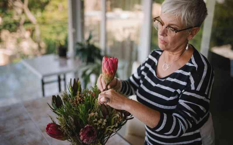 senior woman decorating her apartment